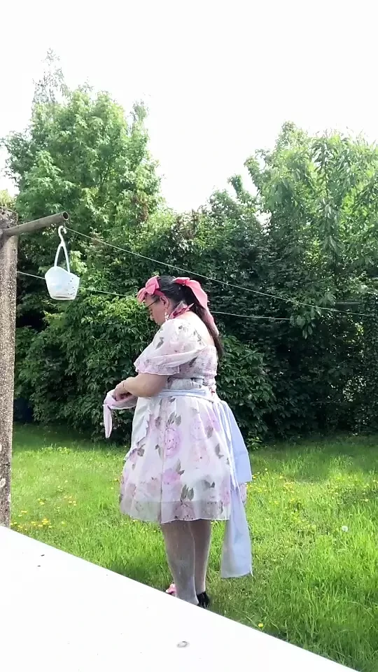 In outfit with a little babydoll dress to hang the laundry.