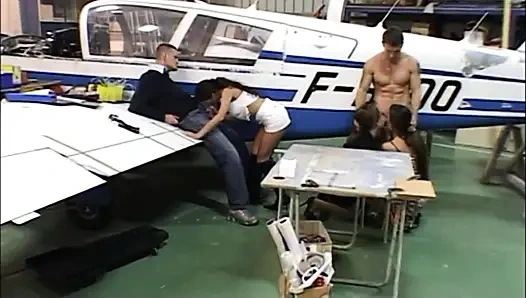 Two sluts are roughly banged in a plane hangar
