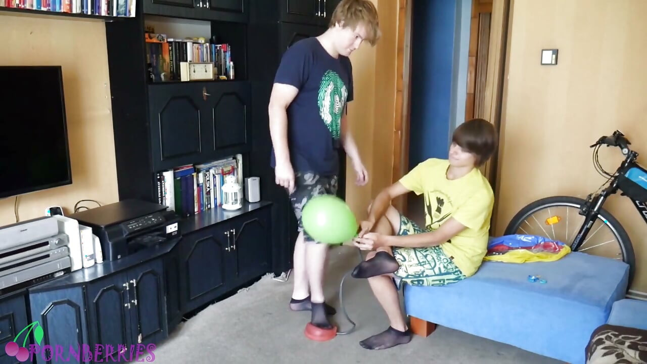 Thin, black socks blowing up balloons + footjob