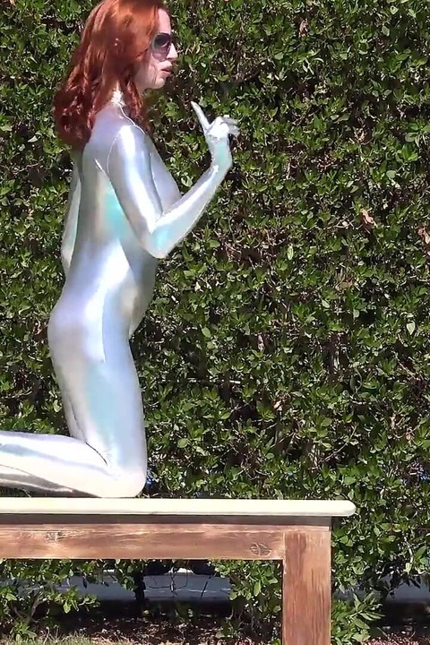 Bending in a Silver Spandex Suit