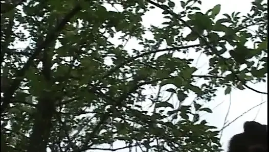 Mature woman gets a younger woman naked outside and fingers her cunt