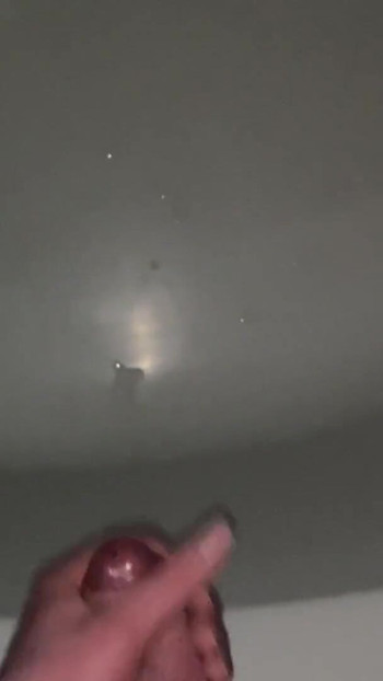 Captivating moment from "Young guy cums hard after rough cock jerking in bathroom"