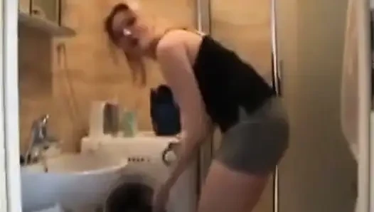 Footjob wife makes him lay down in the bathroom