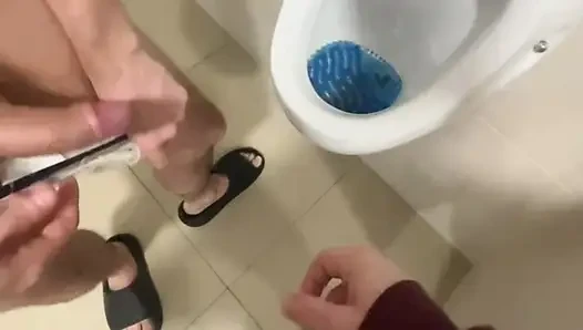2 Boys Having Fun at the Pool Public Toilets' Urinal