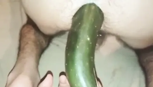Cucumber inside ass of husband