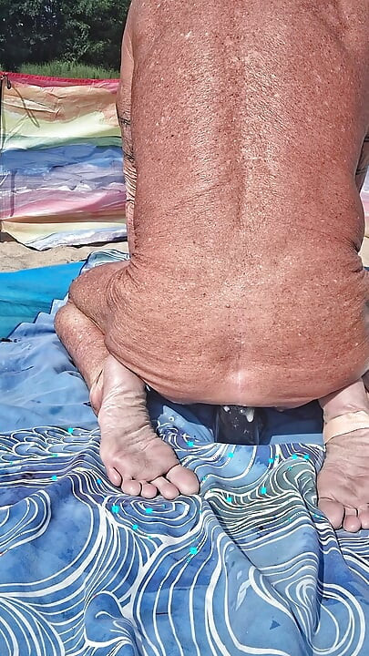 Early morning at the beach stretching of my asshole with my huge black dildo