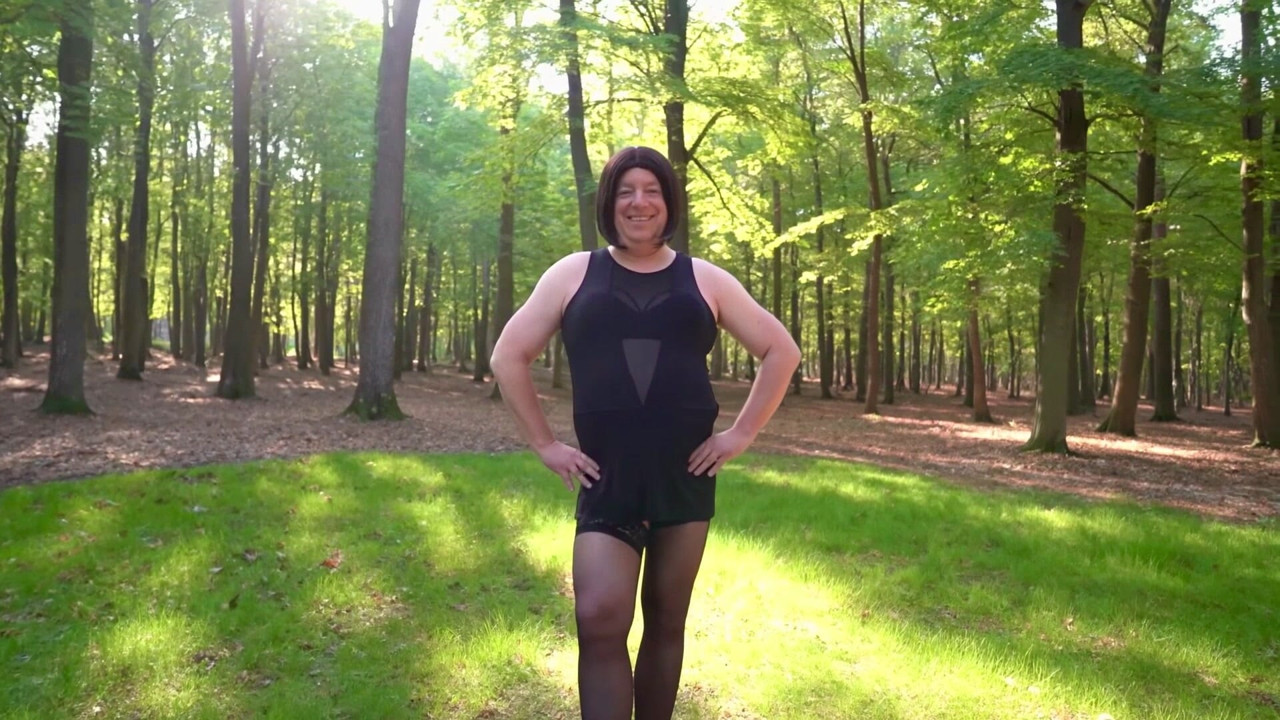 Nicki crossdress in sexy black mesh mini dress, hold-ups and Chelsea boots in the forest (KI)
