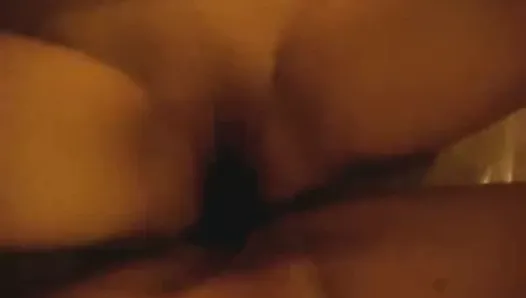Two chicks humping a double-headed dildo