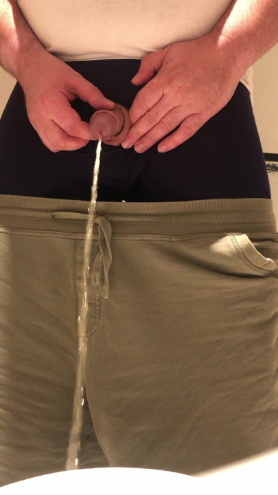 Pulling out my small uncut cock and releasing some warm yellow piss into the toilet.