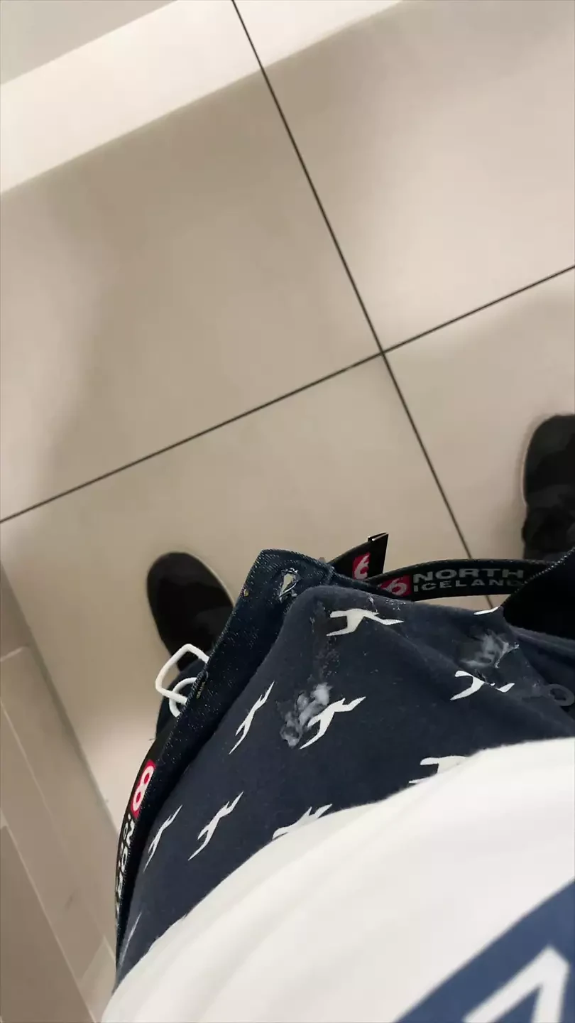 boy is wanking in mall stall bathroom