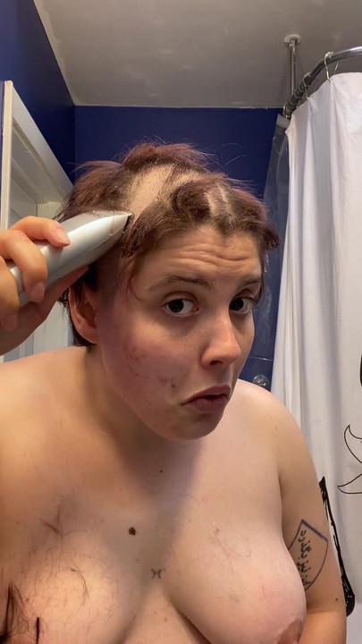 Iconic moment from "Hairless Whore - Adama Daat Amateur Fetish Head and Brow Shave"
