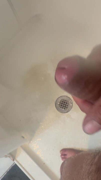 Latino in shower playing