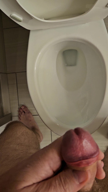 Hard small uncut dick peeing
