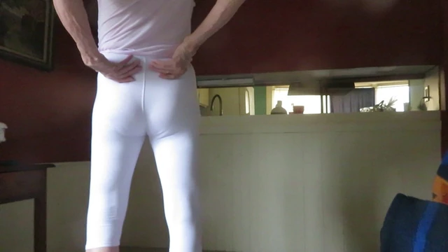 Male slut in skin-tight white spandex leggings.