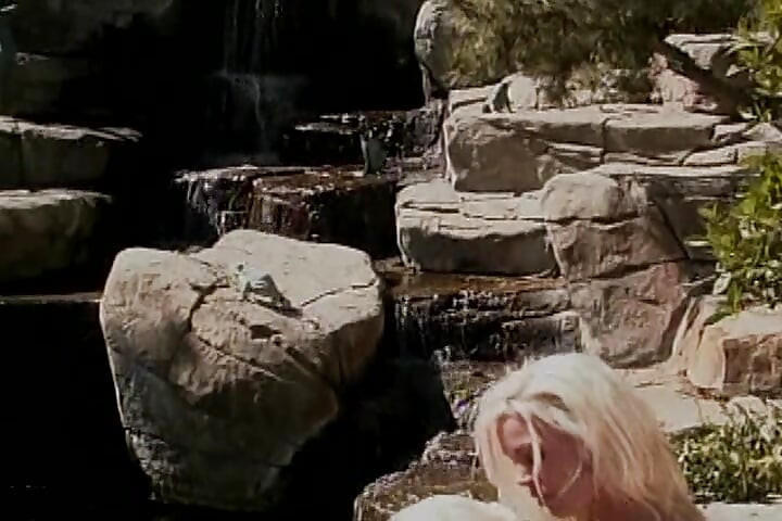 Strapon loving lesbians having fun by the pool