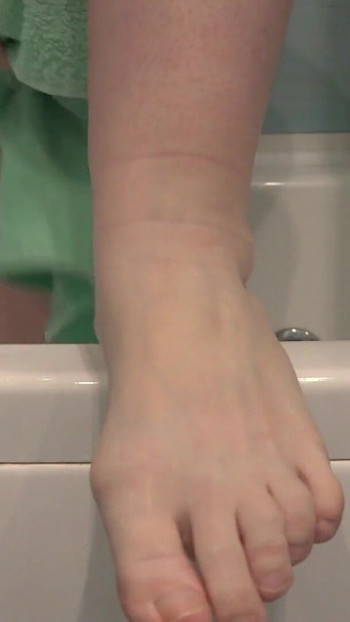 Key moment from "Mature feet in soapy foam. Amateur foot fetish close-up. ASMR."