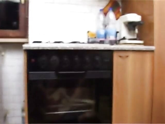 Lustful brunette gets banged in the kitchen by a young pig