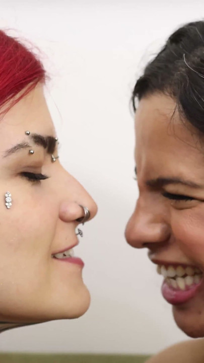 Mibby and Devil Goddess Engage in an Intense Moment of Face-licking