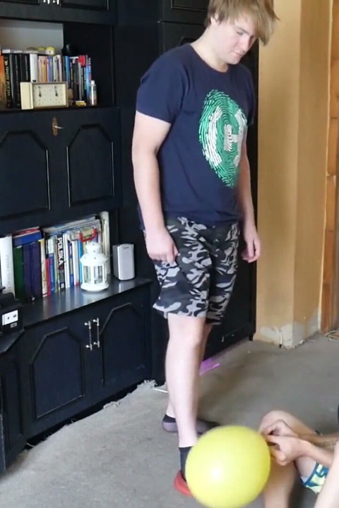 Thin, black socks blowing up balloons + footjob