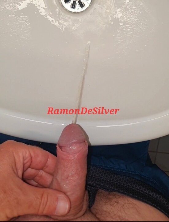 Master Ramon goes to piss in the sink in his sexy shorts, hot
