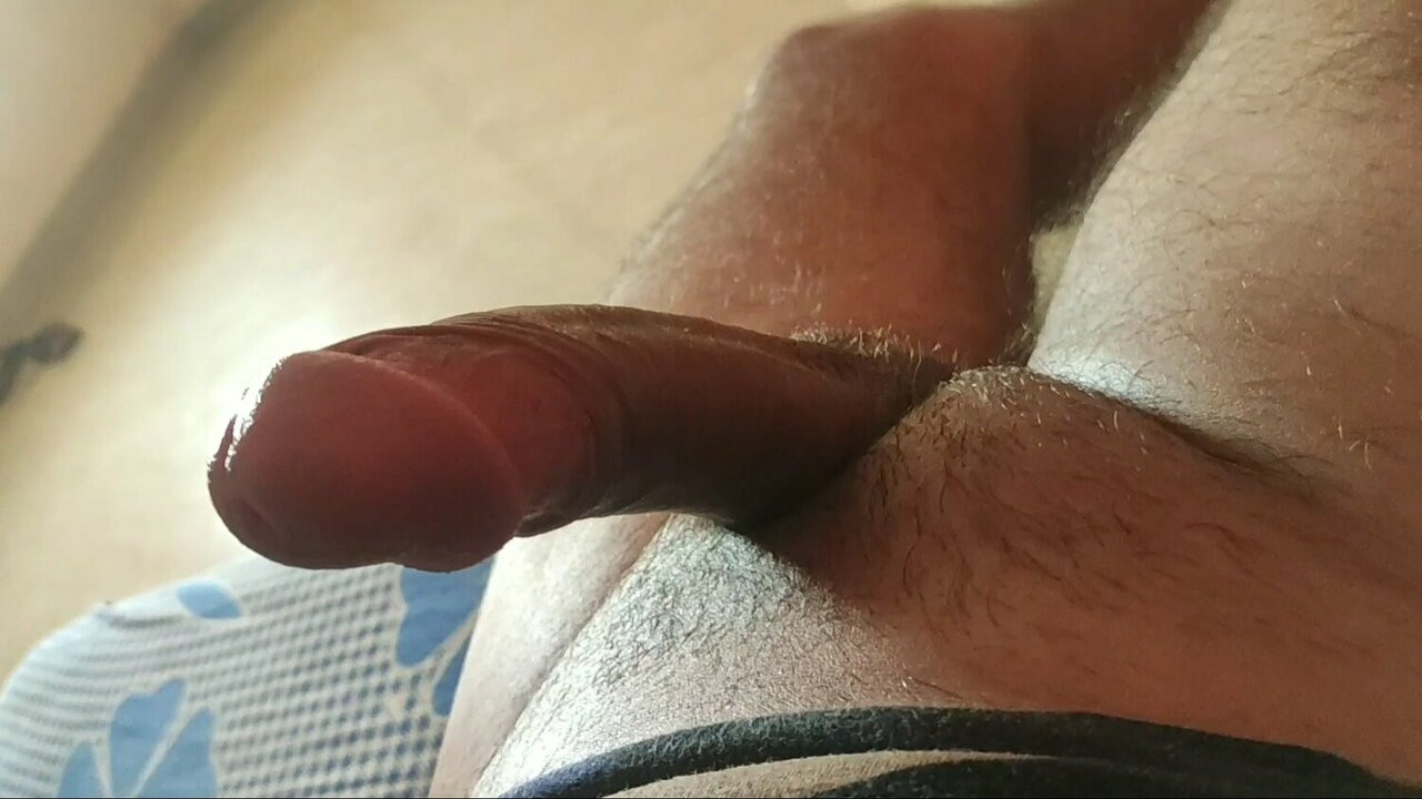 Indian boy sharpening his bull