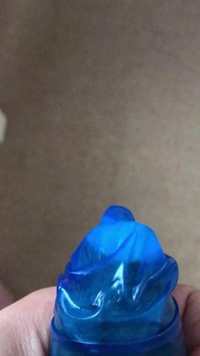 master wanking into the condom for the slave