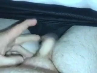 Playing with the little uncut willy between his legs