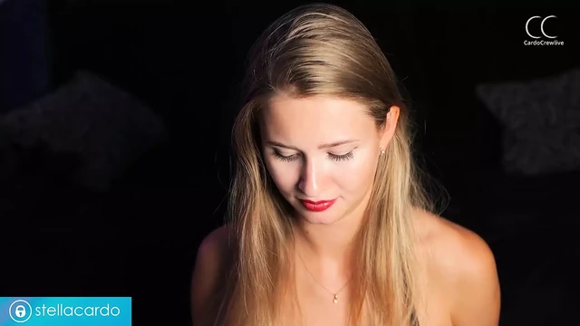 Sexy babe in a leather bodysuit sucks a dildo