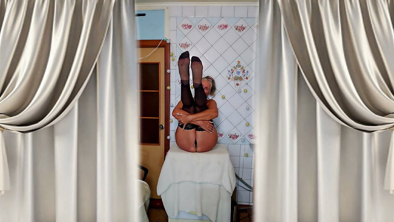 Hot housewife Lukerya flirts and changes clothes in the kitchen.
