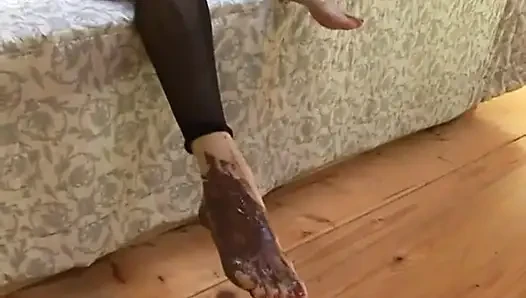 Brunette babe gives footjob to lucky guy