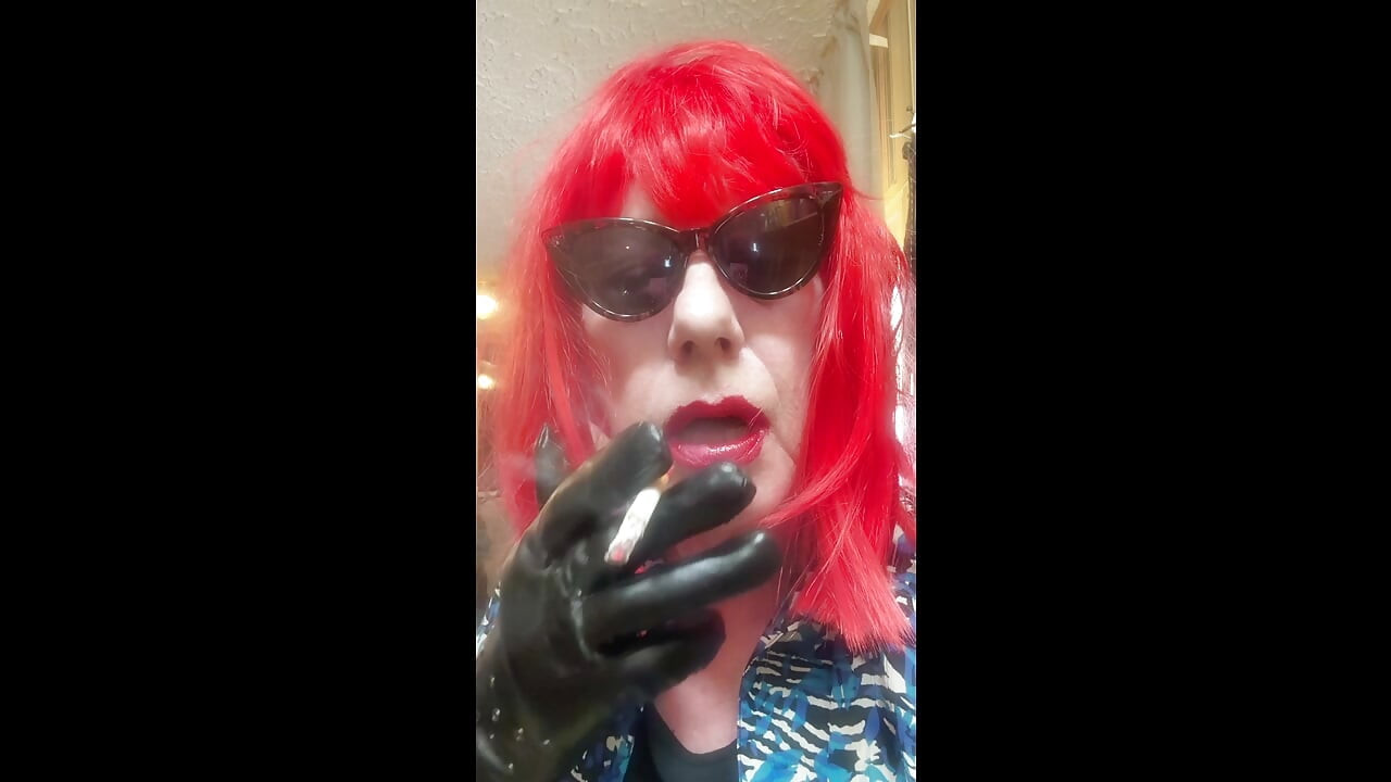 MRS. ROMAN DESTROYING A MARLBORO 100 MENTHOL CLOSE UP - WITH DANGLING AND NOSTRIL EXHALES