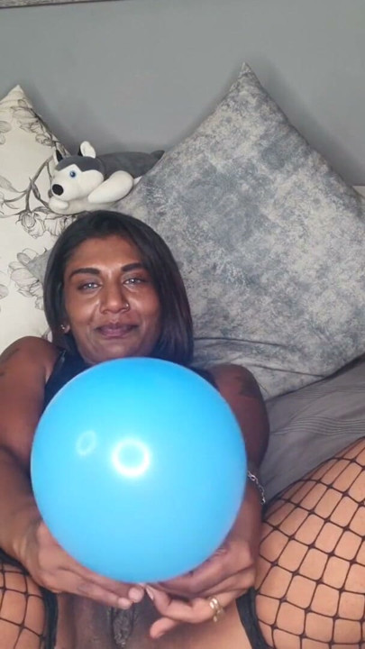 Desi in sexy latex outfit playing with balloons, dirty talking | Clip 1