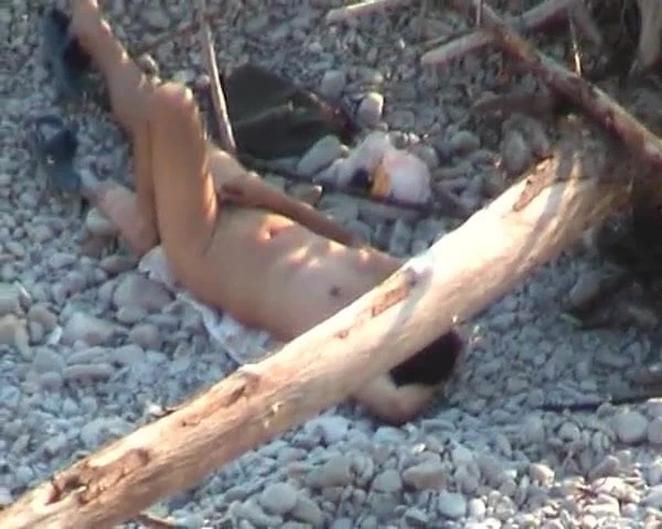 Guy wanking on beach