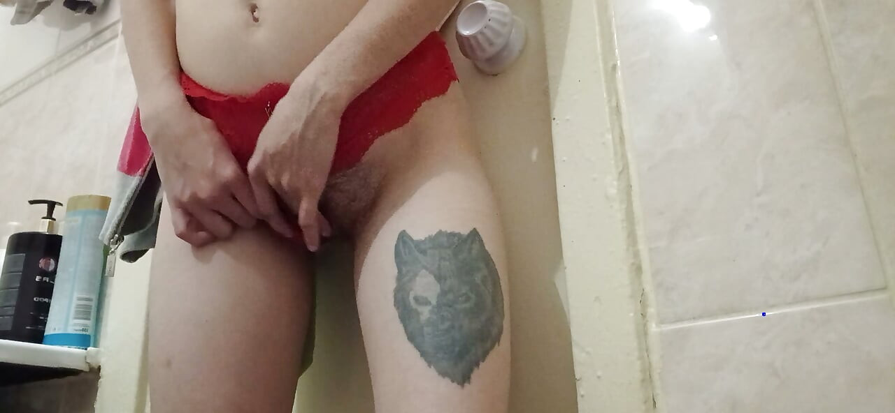 A skinny student girl in red panties masturbates her hairy pussy