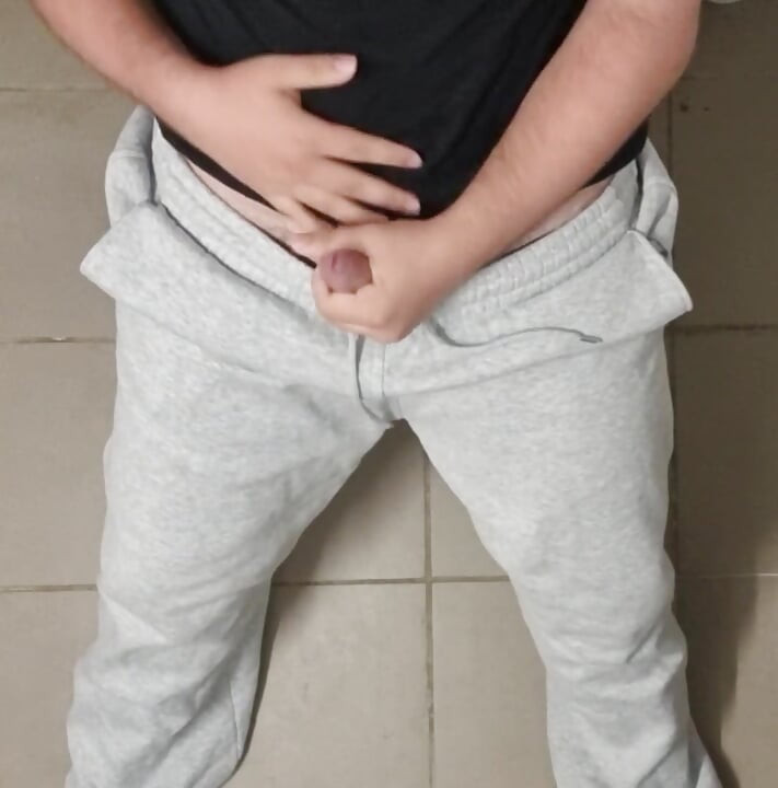 Big cock comes in gray sweatpants