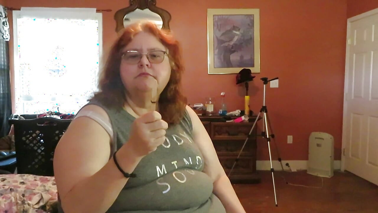 BBW nurse Vicki enjoys eatting a chocolate vanilla ice cream popsiscle