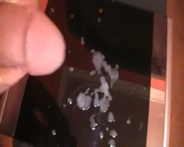 SQUIRTING JIZZ ON BLACK GLASS