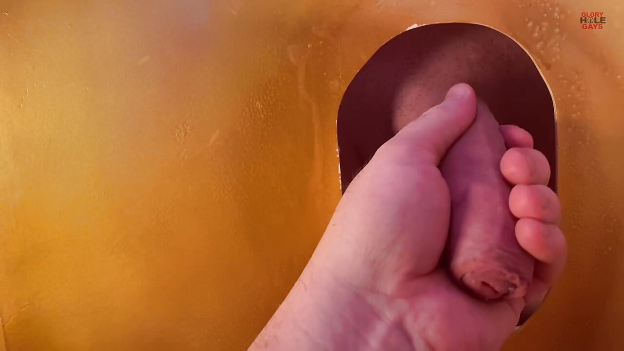 Young straight guy with a big cock at the gloryhole