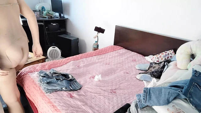 Amateur wife having fun trying on clothes she cuts.