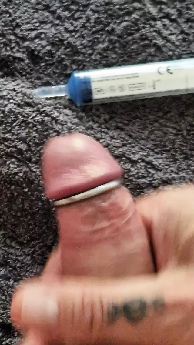 Playing with my uncut cock, ring around my glans. Squirting lube in my dick and jerking off until I come
