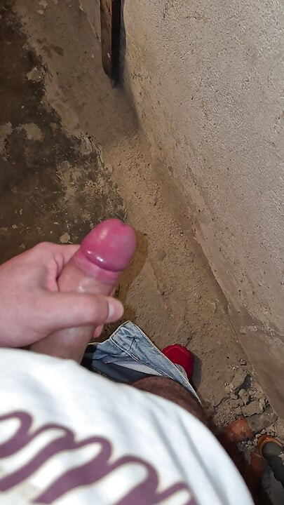 Juicy Bulgarian cock hardens and finally spurts semen onto the wall of a dirty, old, abandoned warehouse.