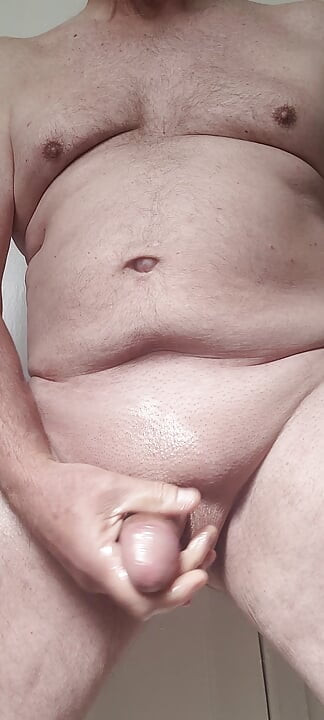 Solosexual strokes my shaved, oiled up cock to get a load of cum to swallow