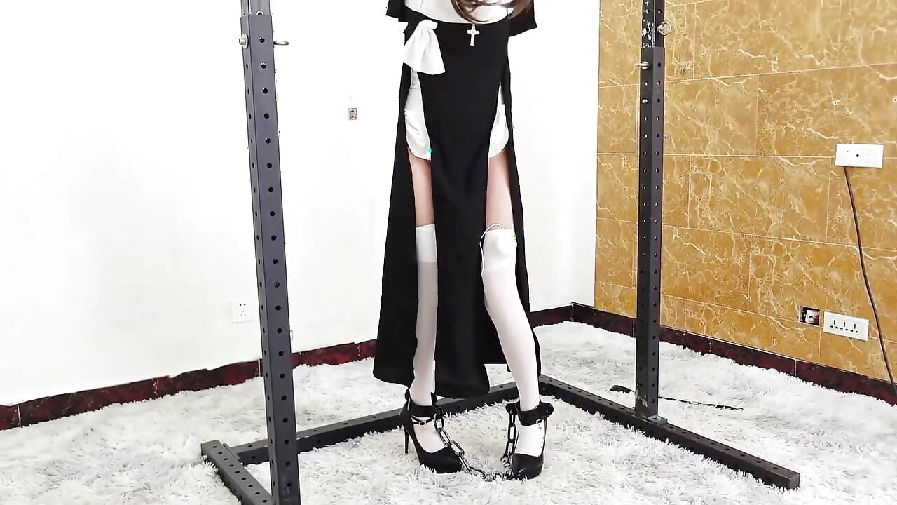 The Girlfriend Role-plays a Nun, Handcuffed and Shackled, Bound to an Iron Frame