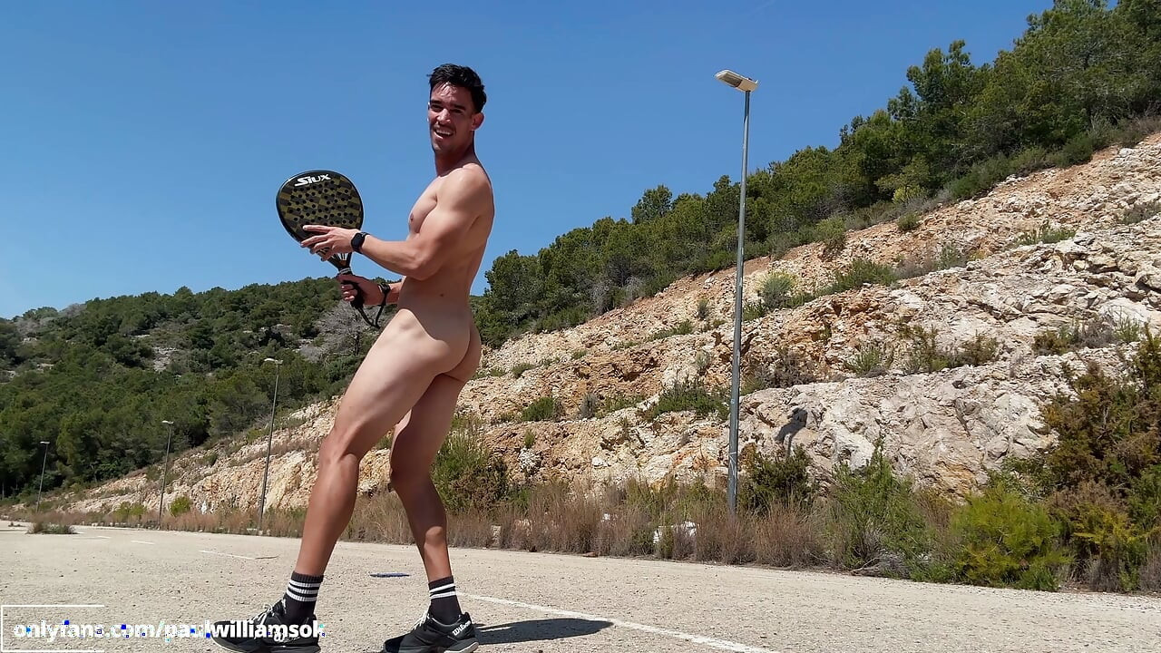 Fitness man training padel naked outdoor