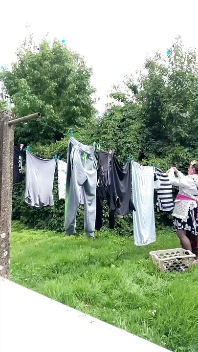 In gardening outfit to hang the laundry