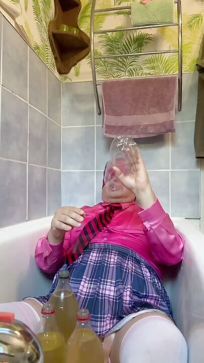 In a schoolgirl outfit to take a piss shower with bottles