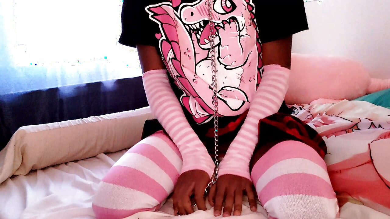 Leashed black sissy femboy shows off chastity cage and tight ass
