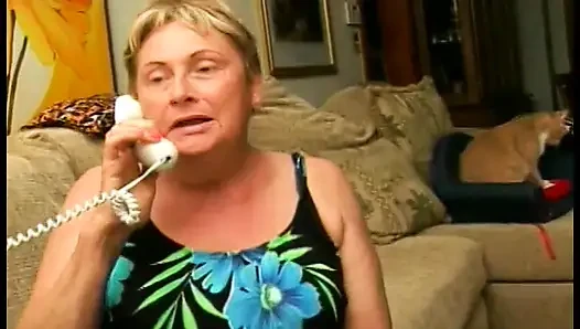A big granny puts a cock in her mouth and jerks a guy off