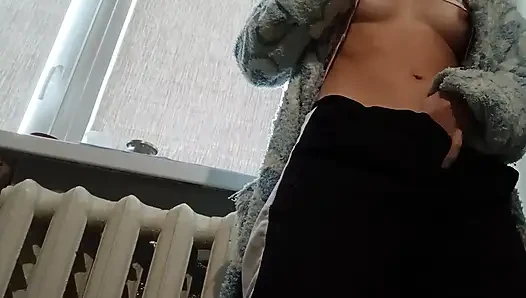 A slender brunette in a robe masturbates at home after university