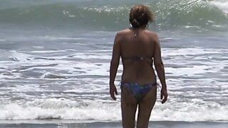 58-year-old Latina MILF shows off on the beach, masturbates